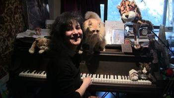Rozalina Gutman, the songwriter of "Lullaby from Purrlandia" with her inspiration - the cat Dr. Sammy. who likes to be around Steinway grandpiano