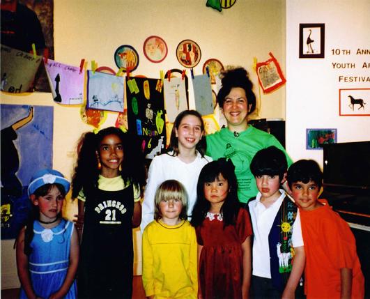 Ms. Rozalina Gutman, concert pianist, educator, composer - with some her little students after their performance of their own original compositions and paintings at the 10th Youth Arts Festival at Berkeley Art Center, CA, USA (while encouraging kids in the audience to draw about the music performed)